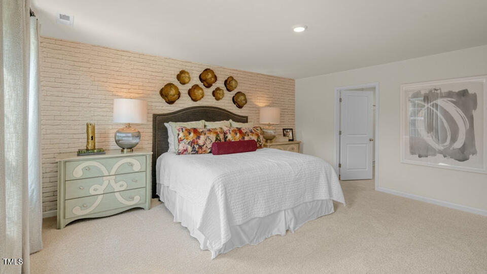 1321 Pavo Path Wendell, NC 27591 - Photo 12 of 30 a bedroom with a bed and a cabinets