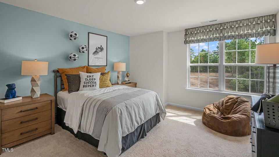 1321 Pavo Path Wendell, NC 27591 - Photo 16 of 30 a bedroom with a bed and window