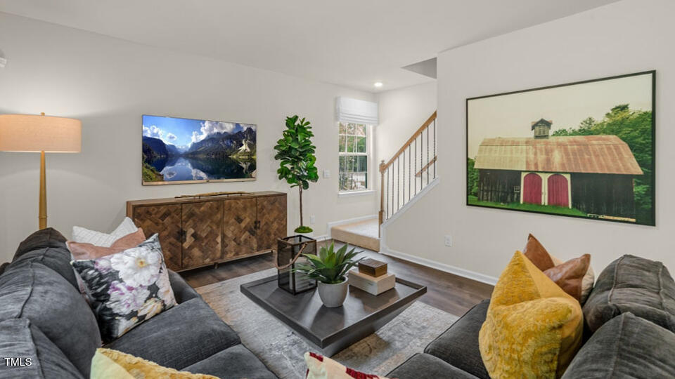 1321 Pavo Path Wendell, NC 27591 - Photo 7 of 30 a living room with furniture and a flat screen tv