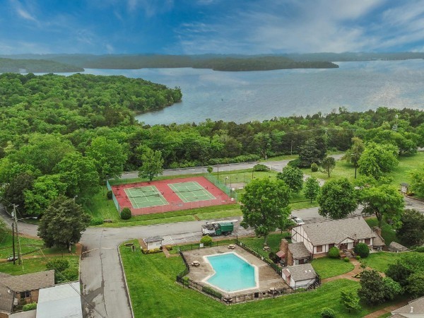 4001 Anderson Road, Unit R105 Nashville, TN 37217 - Photo 15 of 17 a view of a swimming pool with a yard and large trees