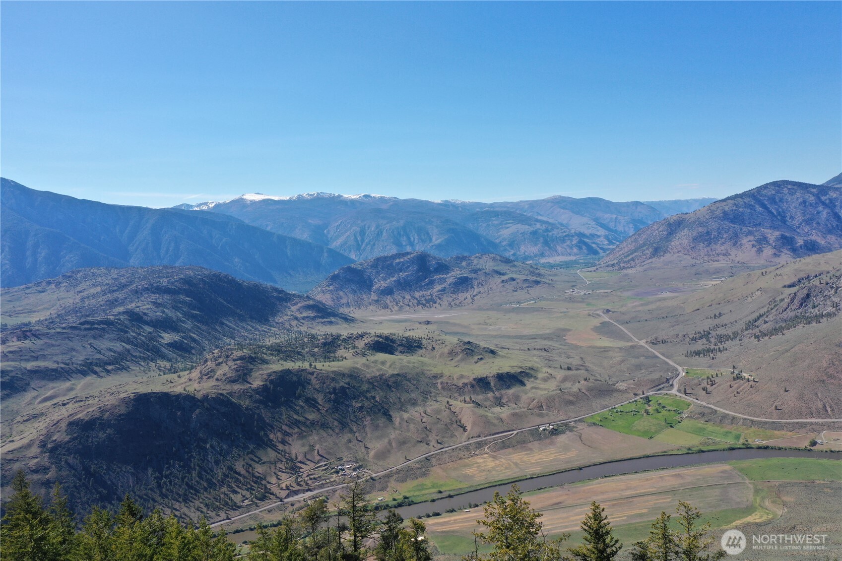 111 Ellemeham Mountain Road Oroville, WA 98844 - Photo 28 of 32 a view of a house with a mountain view