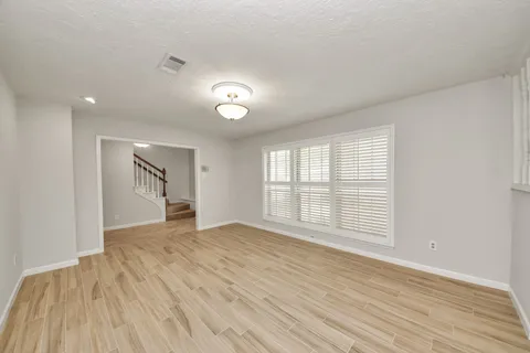a bedroom with a large bed and a fireplace