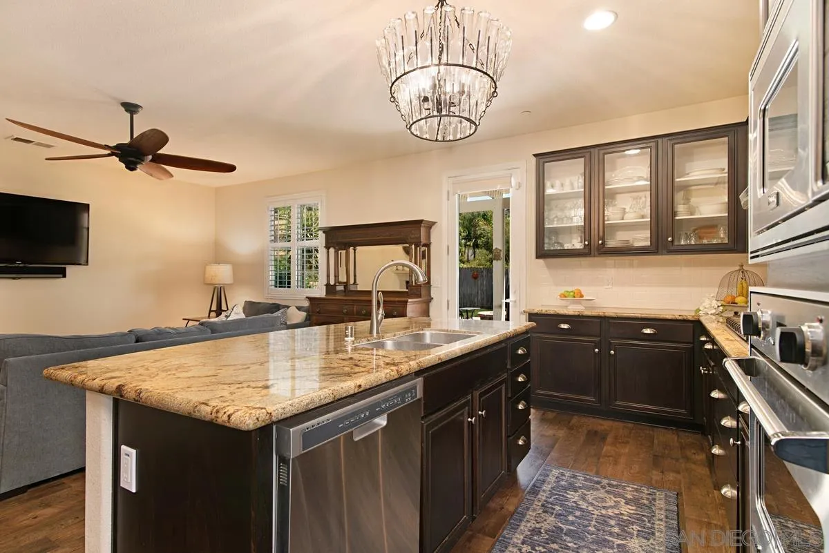 1121 Ocean Ridge Court Oceanside, CA 92056 - Photo 11 of 30 a kitchen with a sink appliances and a counter top space