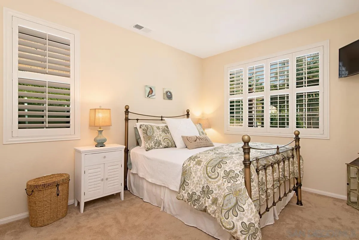 1121 Ocean Ridge Court Oceanside, CA 92056 - Photo 13 of 30 a bedroom with a bed and a window