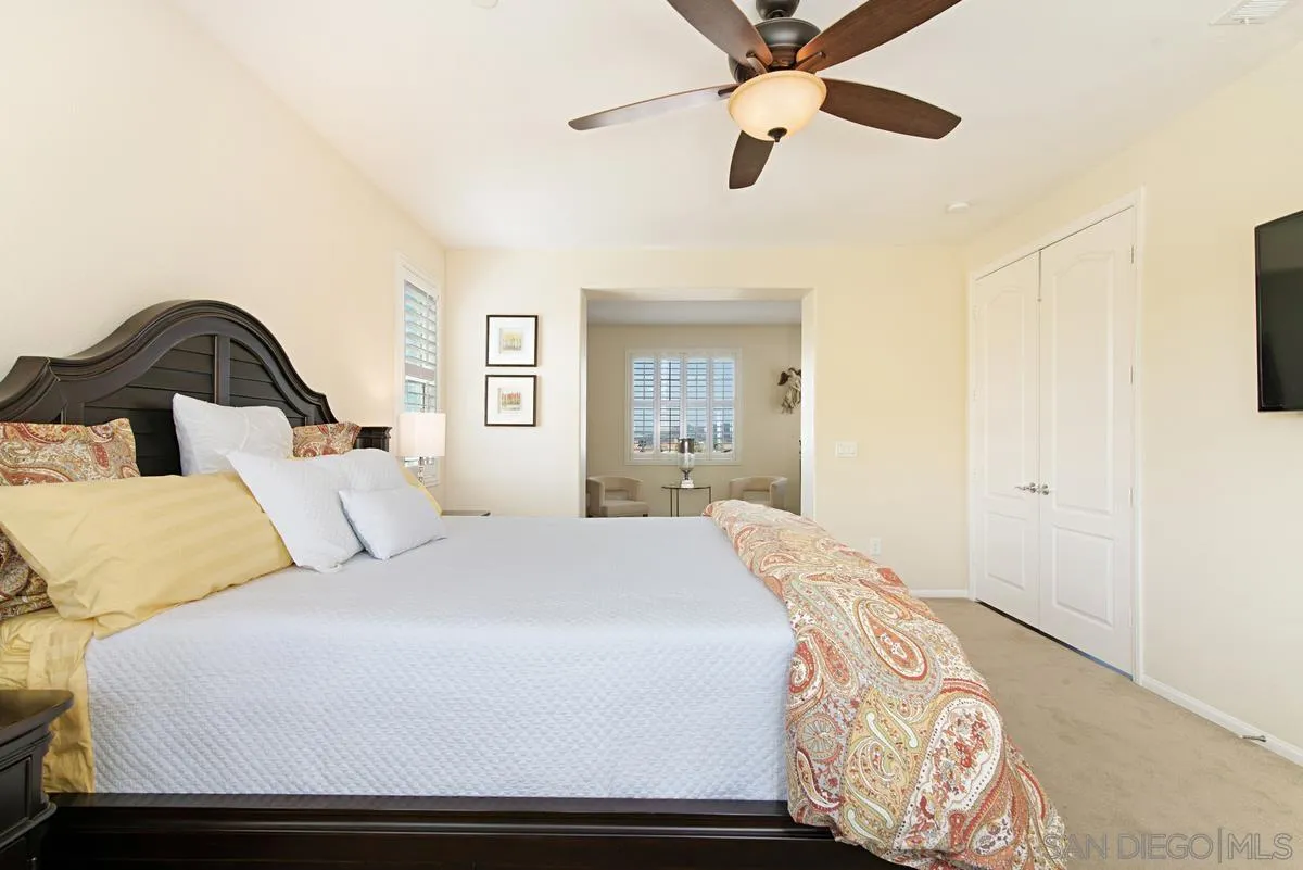 1121 Ocean Ridge Court Oceanside, CA 92056 - Photo 18 of 30 a bedroom with a bed and wooden floor