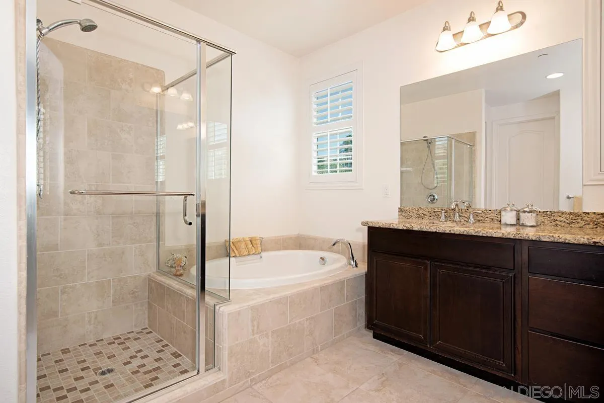 1121 Ocean Ridge Court Oceanside, CA 92056 - Photo 19 of 30 a bathroom with a bathtub a sink and a shower