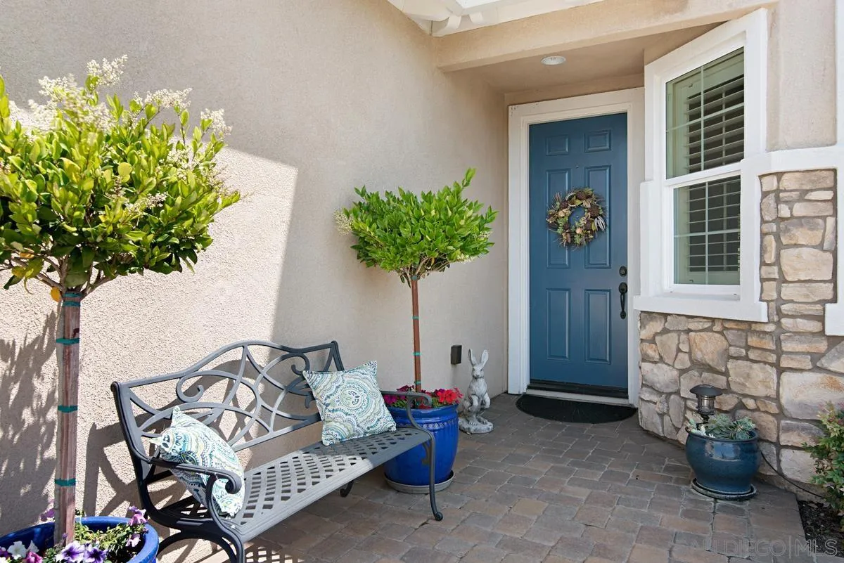 1121 Ocean Ridge Court Oceanside, CA 92056 - Photo 2 of 30 a living room with furniture and a potted plant