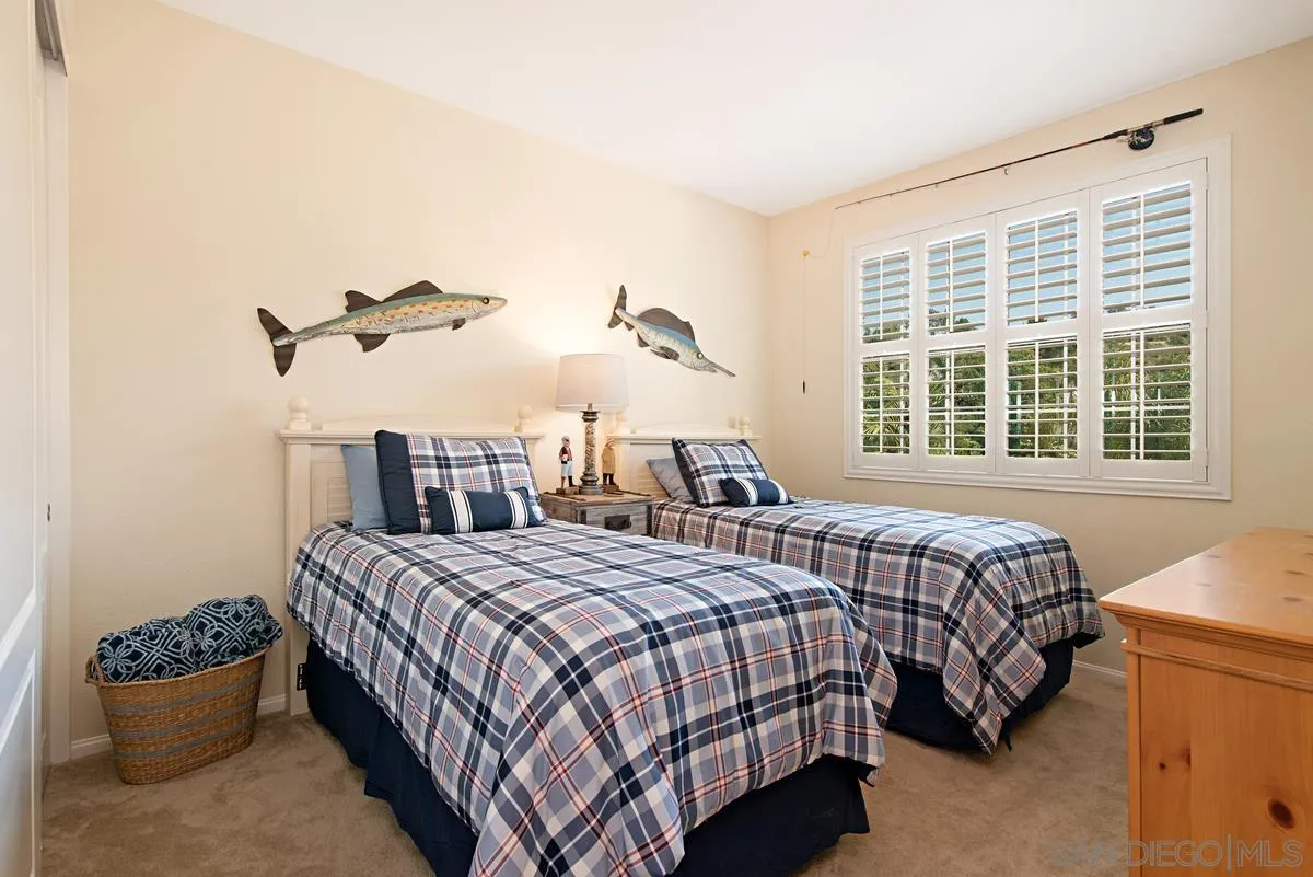 1121 Ocean Ridge Court Oceanside, CA 92056 - Photo 24 of 30 a bedroom with a bed and window
