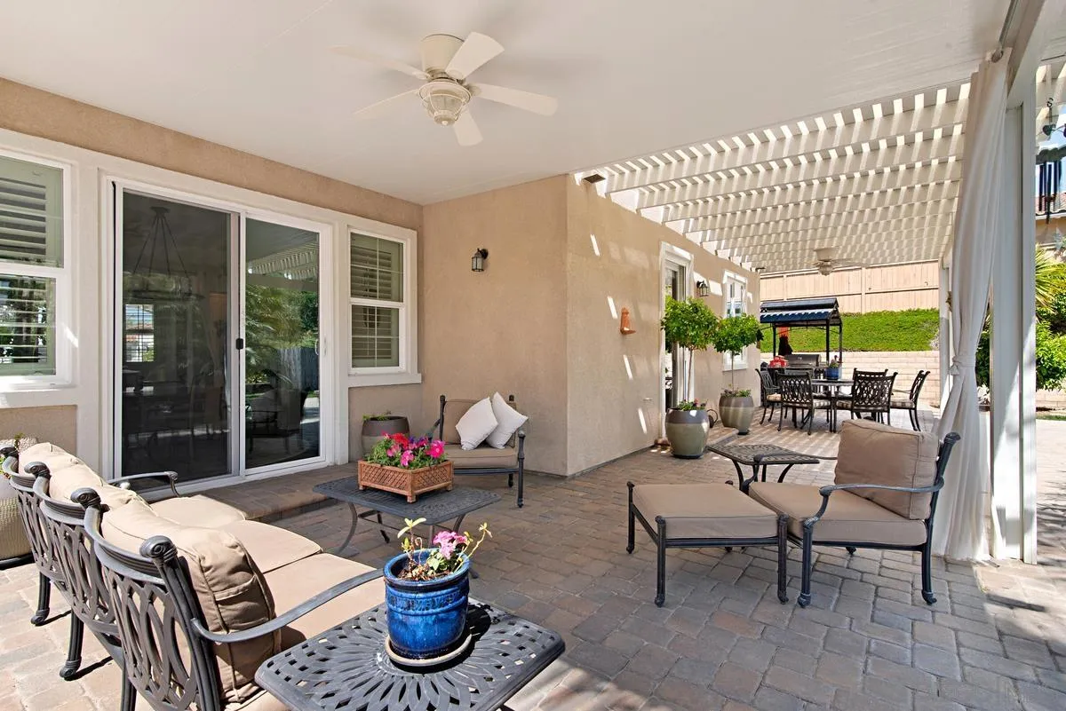 1121 Ocean Ridge Court Oceanside, CA 92056 - Photo 26 of 30 a living room with furniture and a potted plant