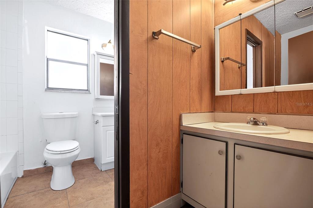 8800 Southeast 89th Place Ocala, FL 34472 - Photo 13 of 18 a bathroom with a sink toilet and shower
