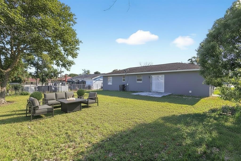 8800 Southeast 89th Place Ocala, FL 34472 - Photo 16 of 18 a view of a house with backyard and patio