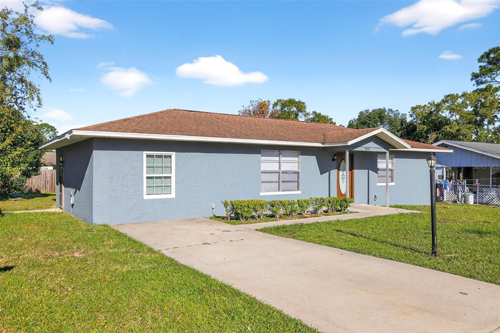 8800 Southeast 89th Place Ocala, FL 34472 - Photo 17 of 18 a front view of a house with a yard