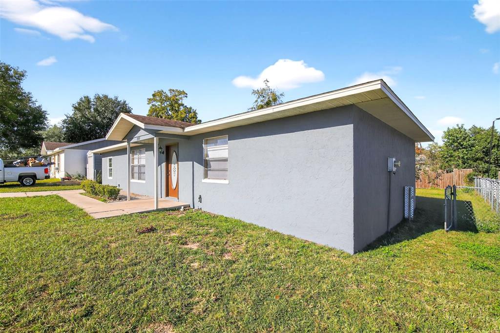 8800 Southeast 89th Place Ocala, FL 34472 - Photo 18 of 18 a front view of house with yard and trees in the background