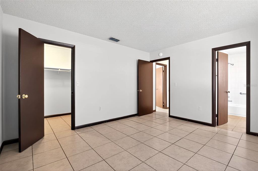 8800 Southeast 89th Place Ocala, FL 34472 - Photo 9 of 18 a view of a livingroom with wooden floor and closet