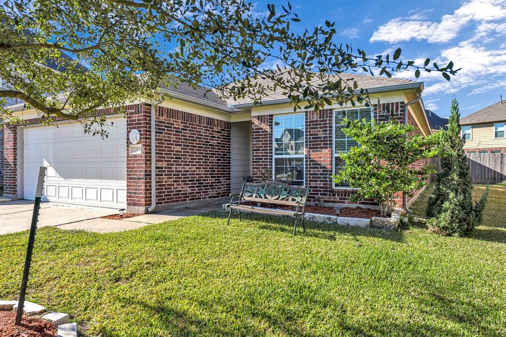 3203 Dale Ridge Trail Houston, TX 77084 - Photo 2 of 33 Alternate front exterior view showcasing the landscaped front yard, mature tree, and home facade.