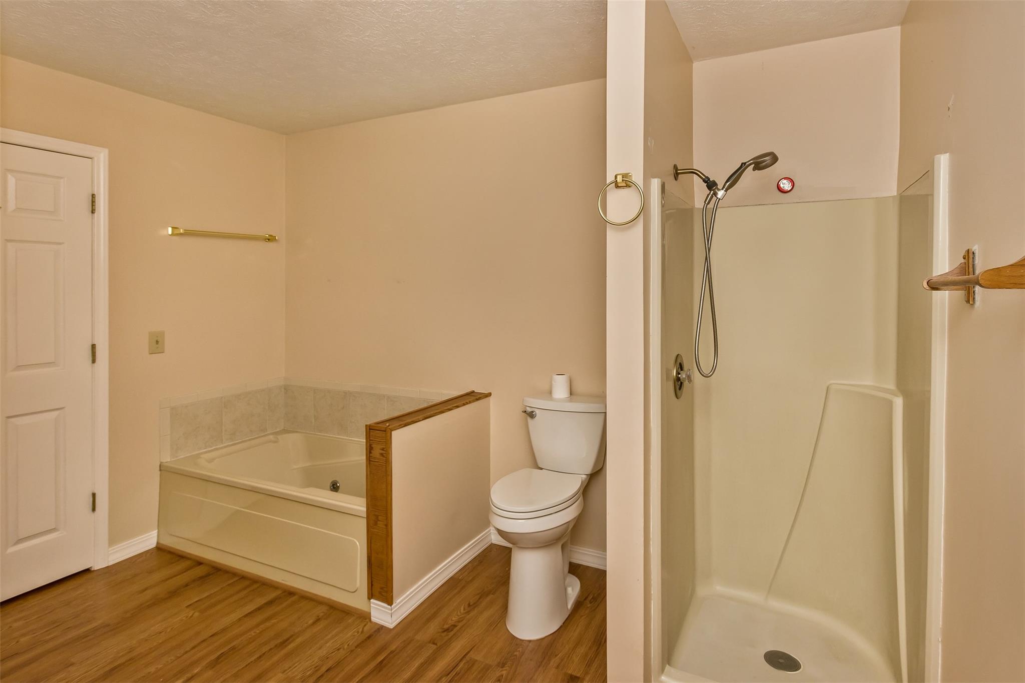 124 Beaverdam Loop Road Candler, NC 28715 - Photo 18 of 25 a bathroom with a shower and a toilet