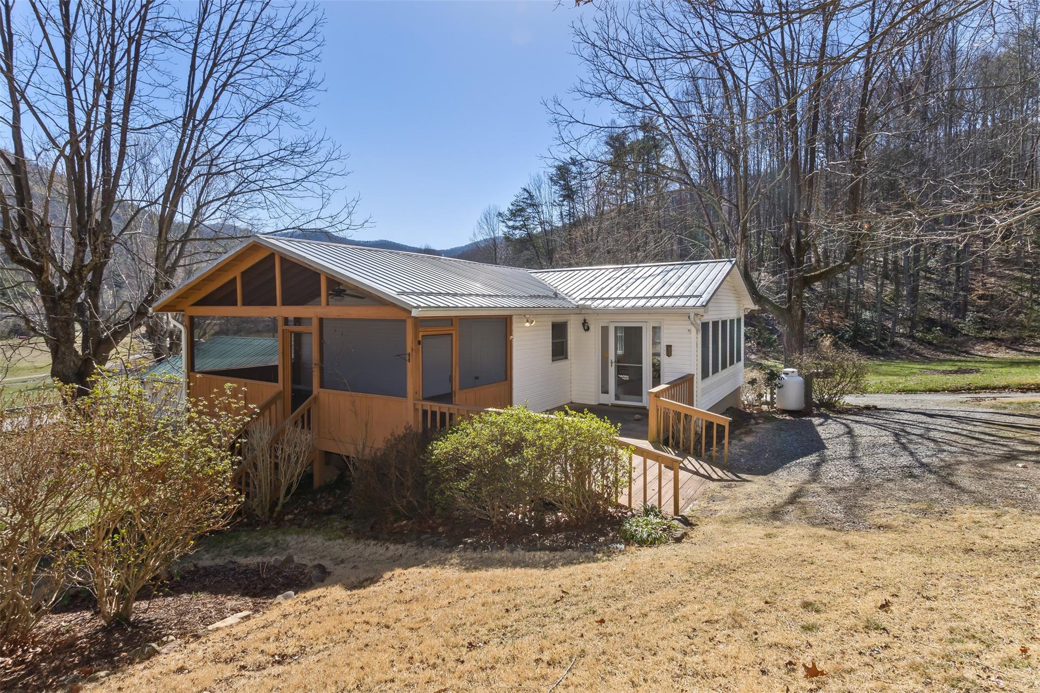 124 Beaverdam Loop Road Candler, NC 28715 - Photo 2 of 25 a view of a house with a yard and large tree