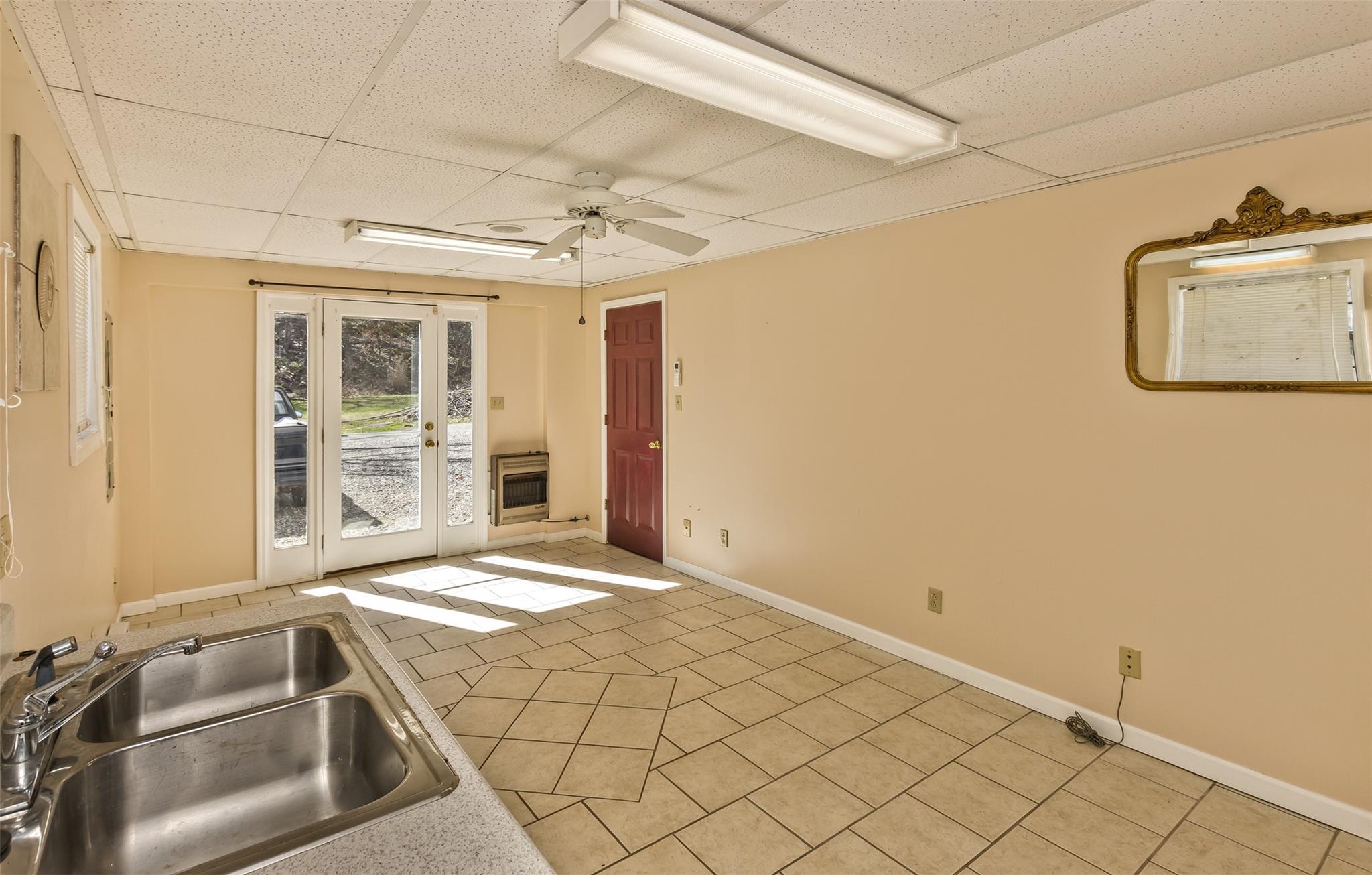 124 Beaverdam Loop Road Candler, NC 28715 - Photo 21 of 25 a view of a room with wooden floor and windows