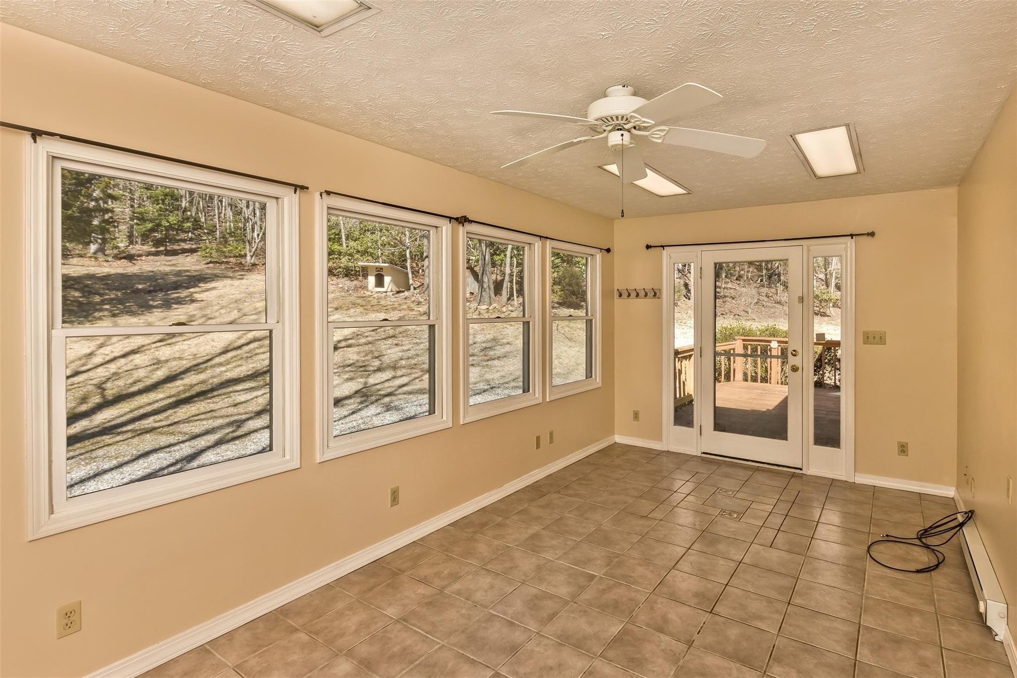 124 Beaverdam Loop Road Candler, NC 28715 - Photo 10 of 25 a view of an empty room with a window