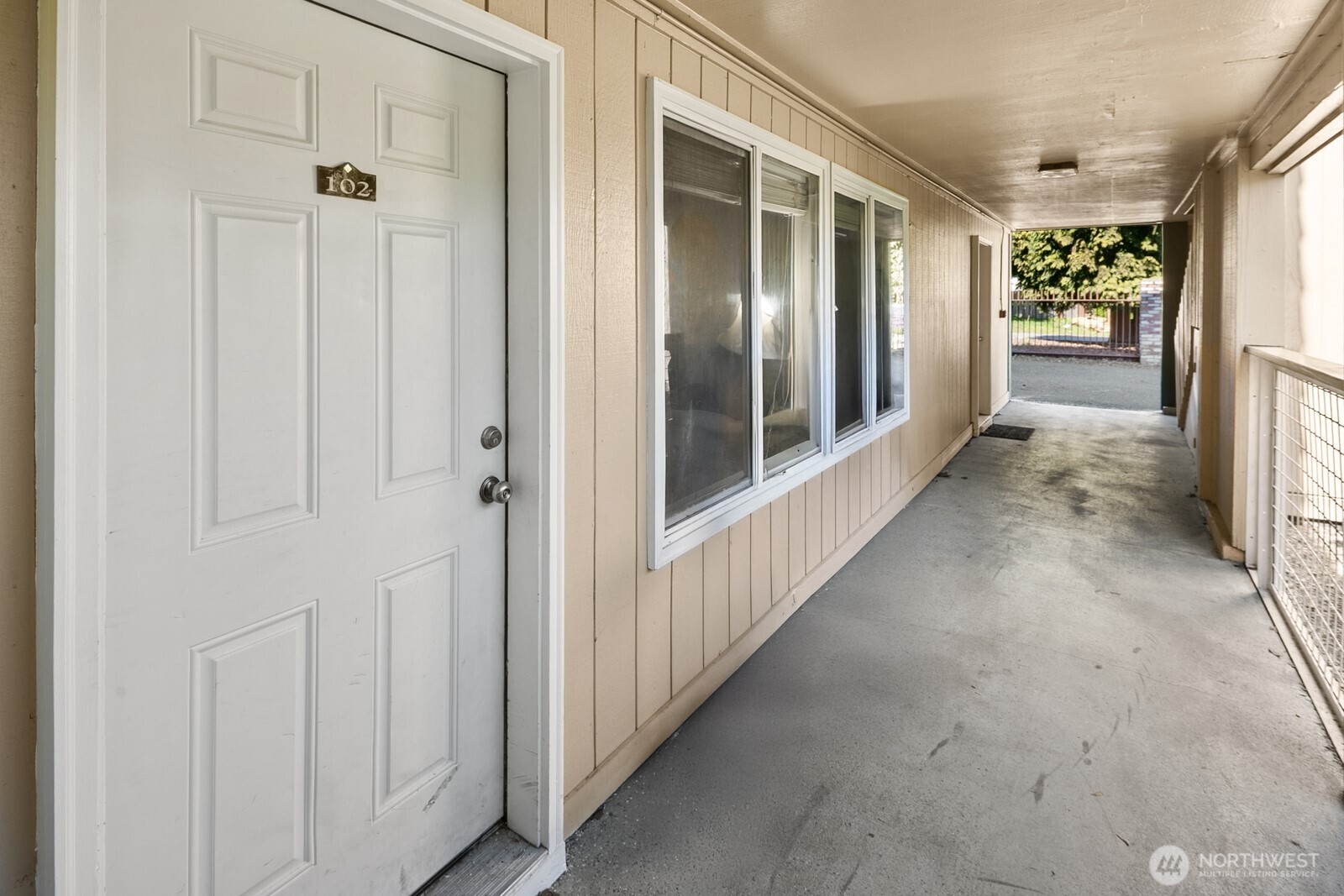 101 Southwest 119th Street, Unit 102 Burien, WA 98146 - Photo 4 of 15 a view of a hallway with wooden floor and closet