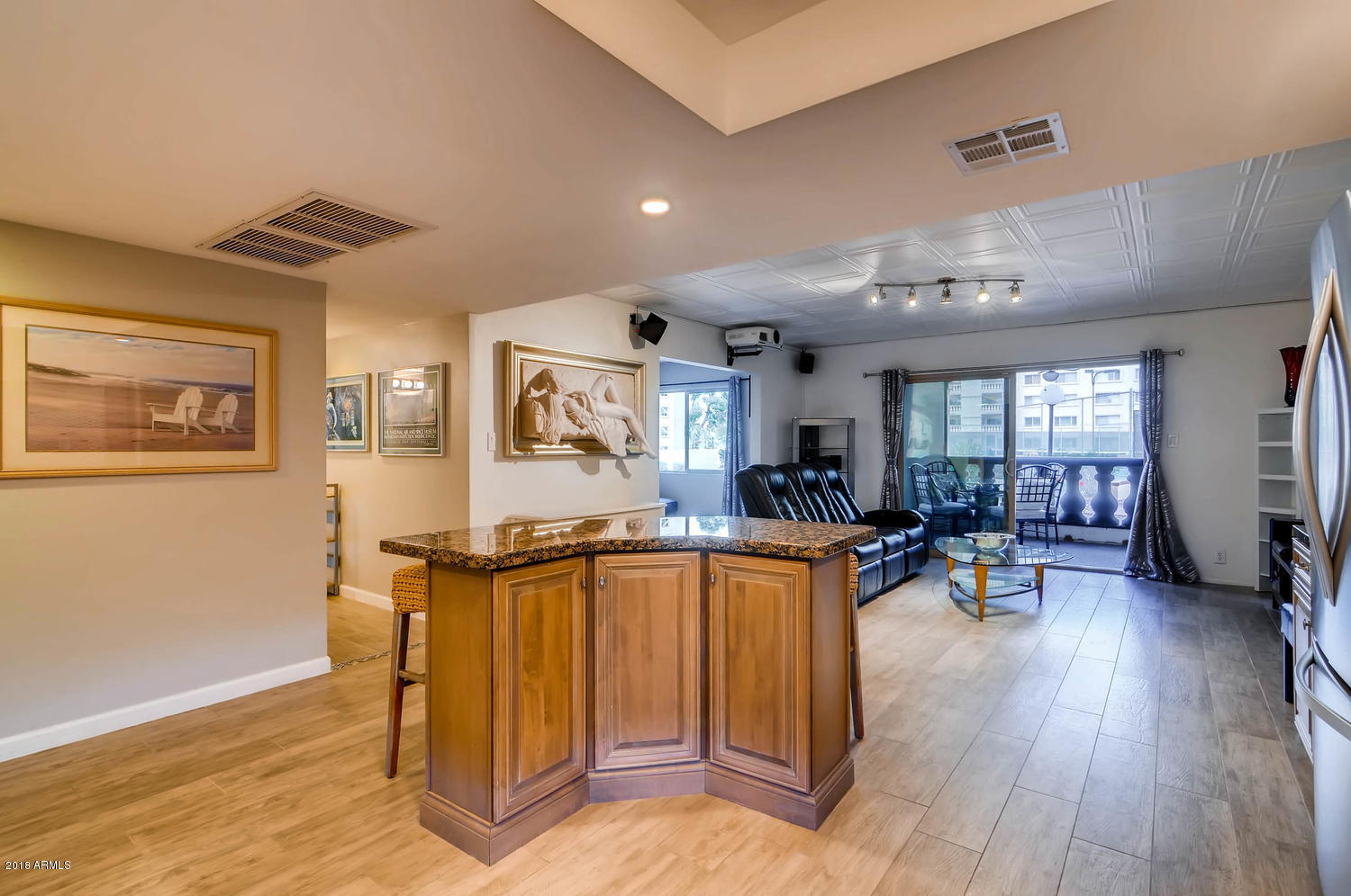 7830 East Camelback Road, Unit 112 Scottsdale, AZ 85251 - Photo 6 of 20 KITCHEN LOOKING ONTO LIVING ROOM
