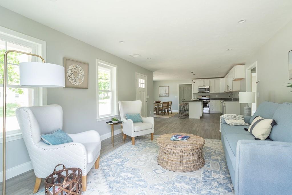11 Indian Neck Road Wareham, MA 02571 - Photo 12 of 41 a living room with furniture and a lamp