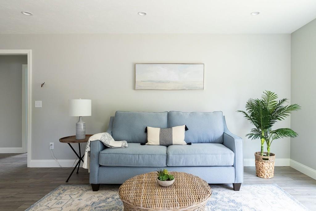 11 Indian Neck Road Wareham, MA 02571 - Photo 14 of 41 a living room with furniture and a potted plant