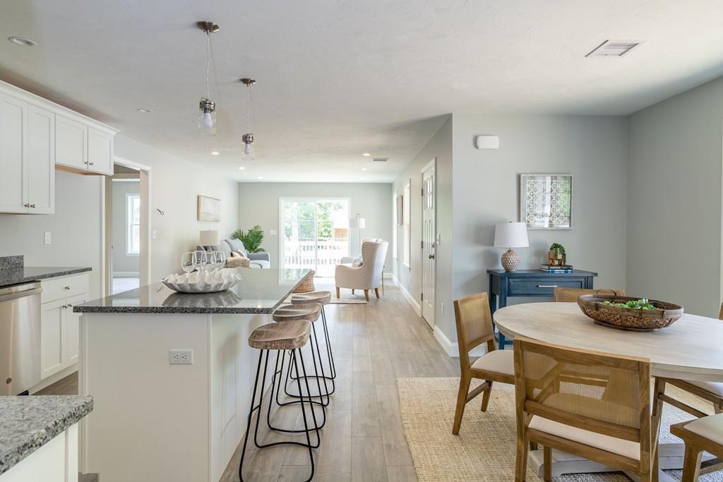 11 Indian Neck Road Wareham, MA 02571 - Photo 19 of 41 a view of a dining room with furniture and wooden floor