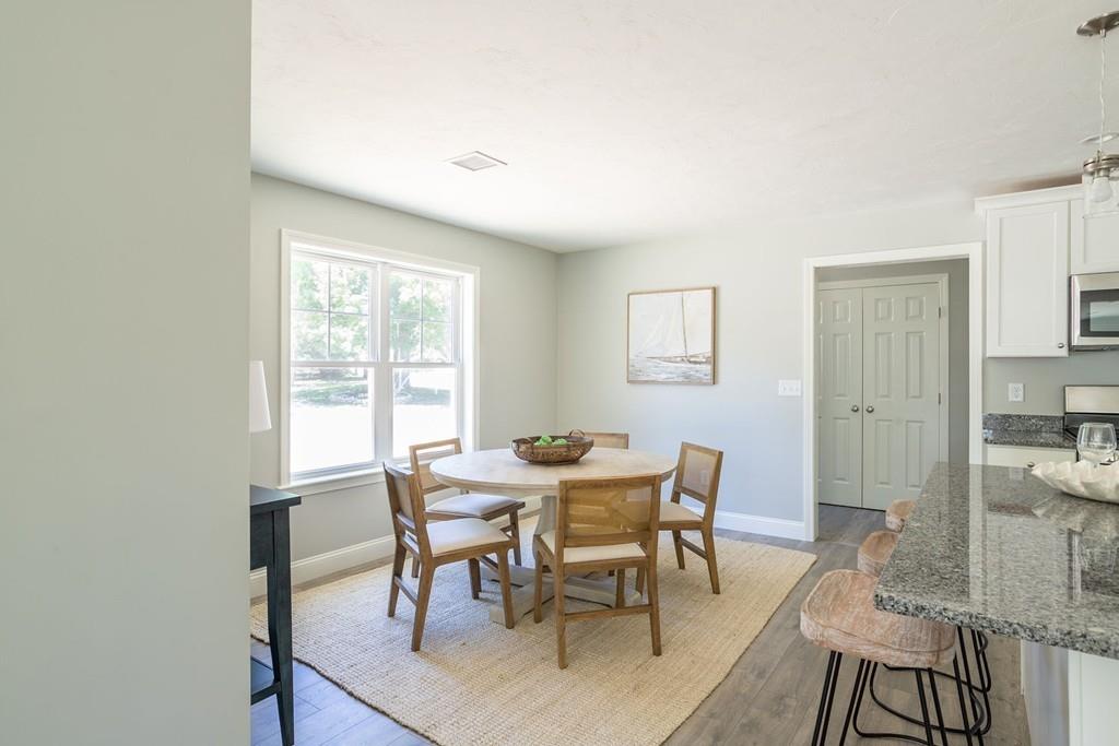 11 Indian Neck Road Wareham, MA 02571 - Photo 22 of 41 a view of a dining room with furniture and a window