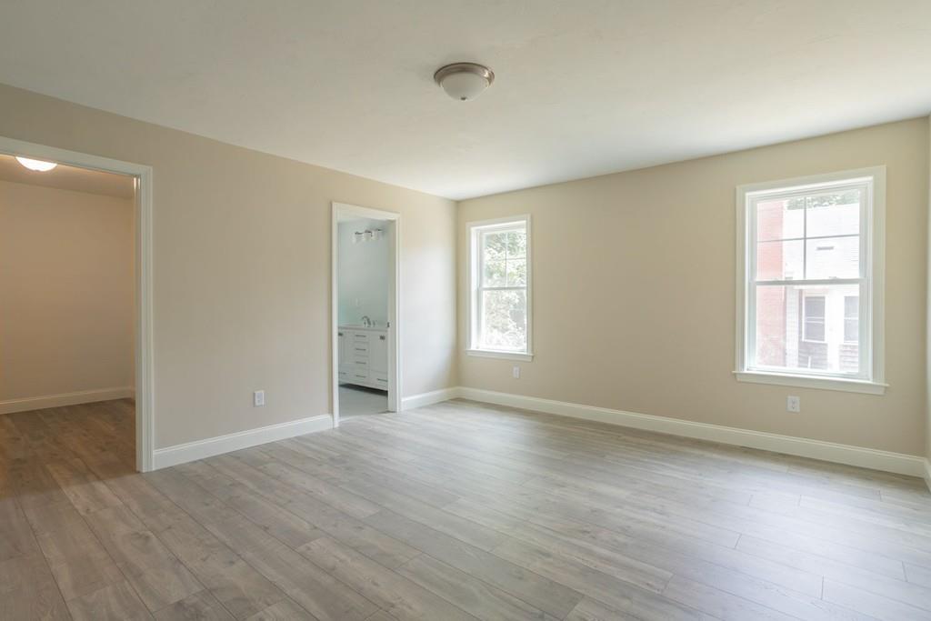 11 Indian Neck Road Wareham, MA 02571 - Photo 28 of 41 a view of an empty room with wooden floor and a window