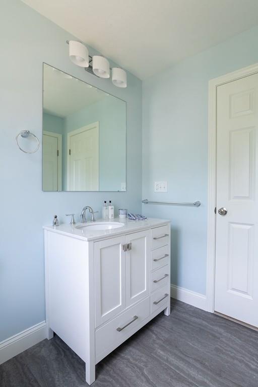 11 Indian Neck Road Wareham, MA 02571 - Photo 39 of 41 a bathroom with a double vanity sink and mirror