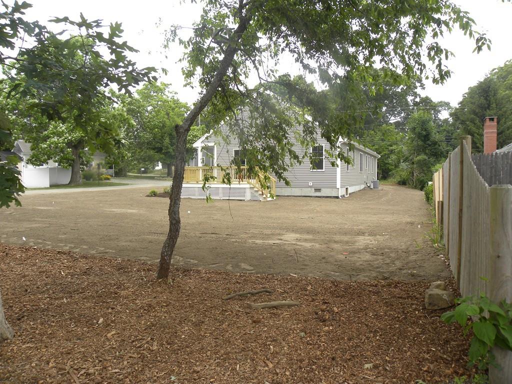 11 Indian Neck Road Wareham, MA 02571 - Photo 4 of 41 a backyard of a house with lots of tall trees