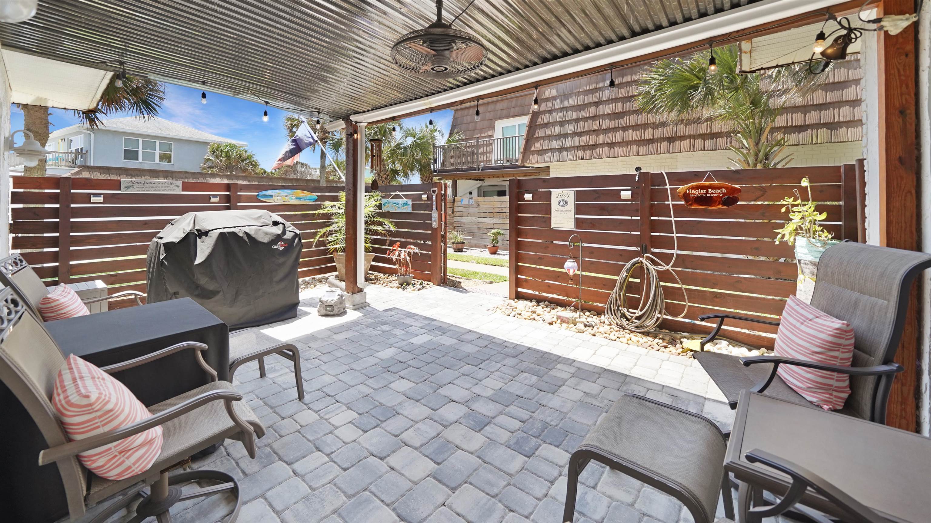 111 South 18th Street Flagler Beach, FL 32136 - Photo 13 of 38 a view of a chairs and a table in the patio