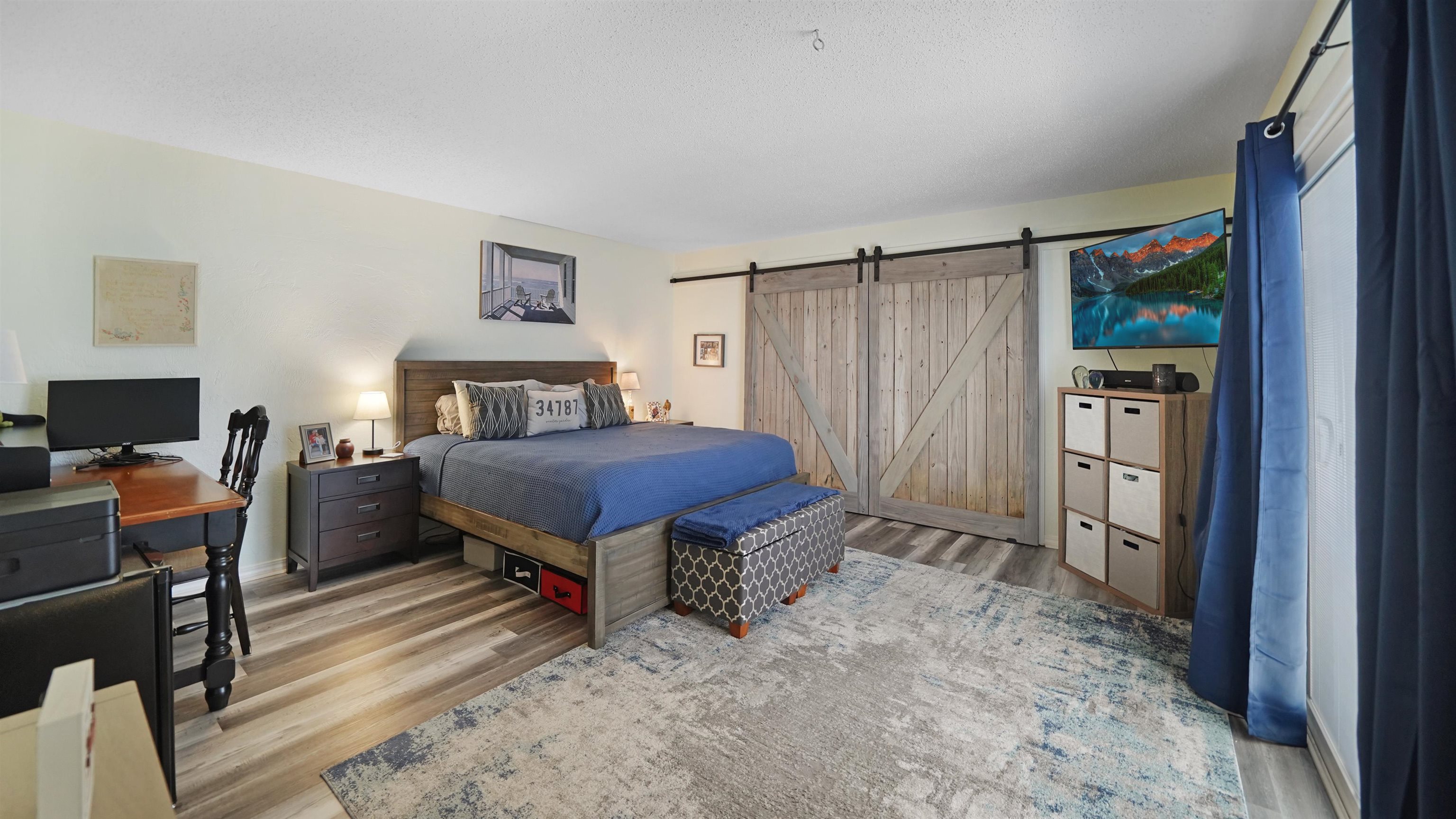 111 South 18th Street Flagler Beach, FL 32136 - Photo 19 of 38 a spacious bedroom with a bed and a desk