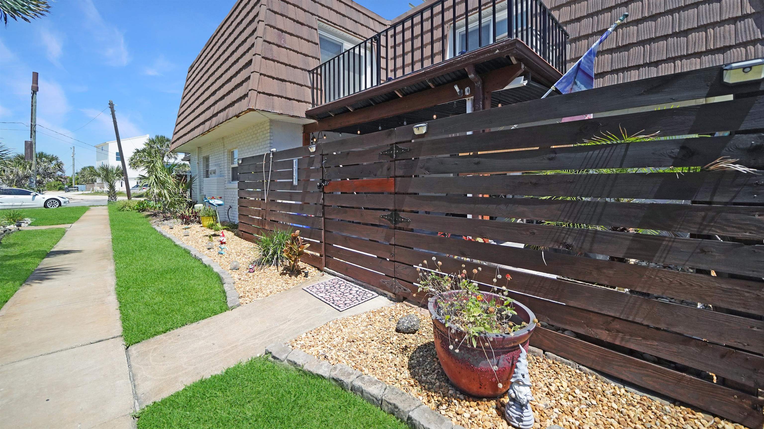 111 South 18th Street Flagler Beach, FL 32136 - Photo 29 of 38 a front view of a house with a garden
