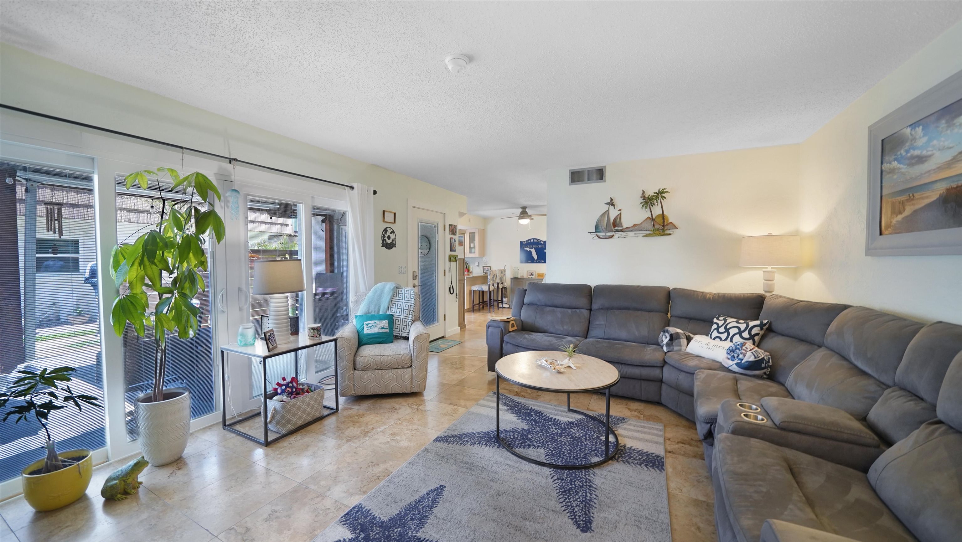 111 South 18th Street Flagler Beach, FL 32136 - Photo 3 of 38 a living room with furniture and a potted plant