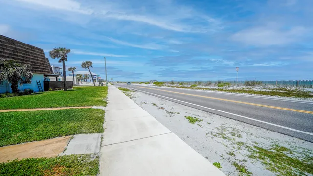 a view of a yard with an ocean view
