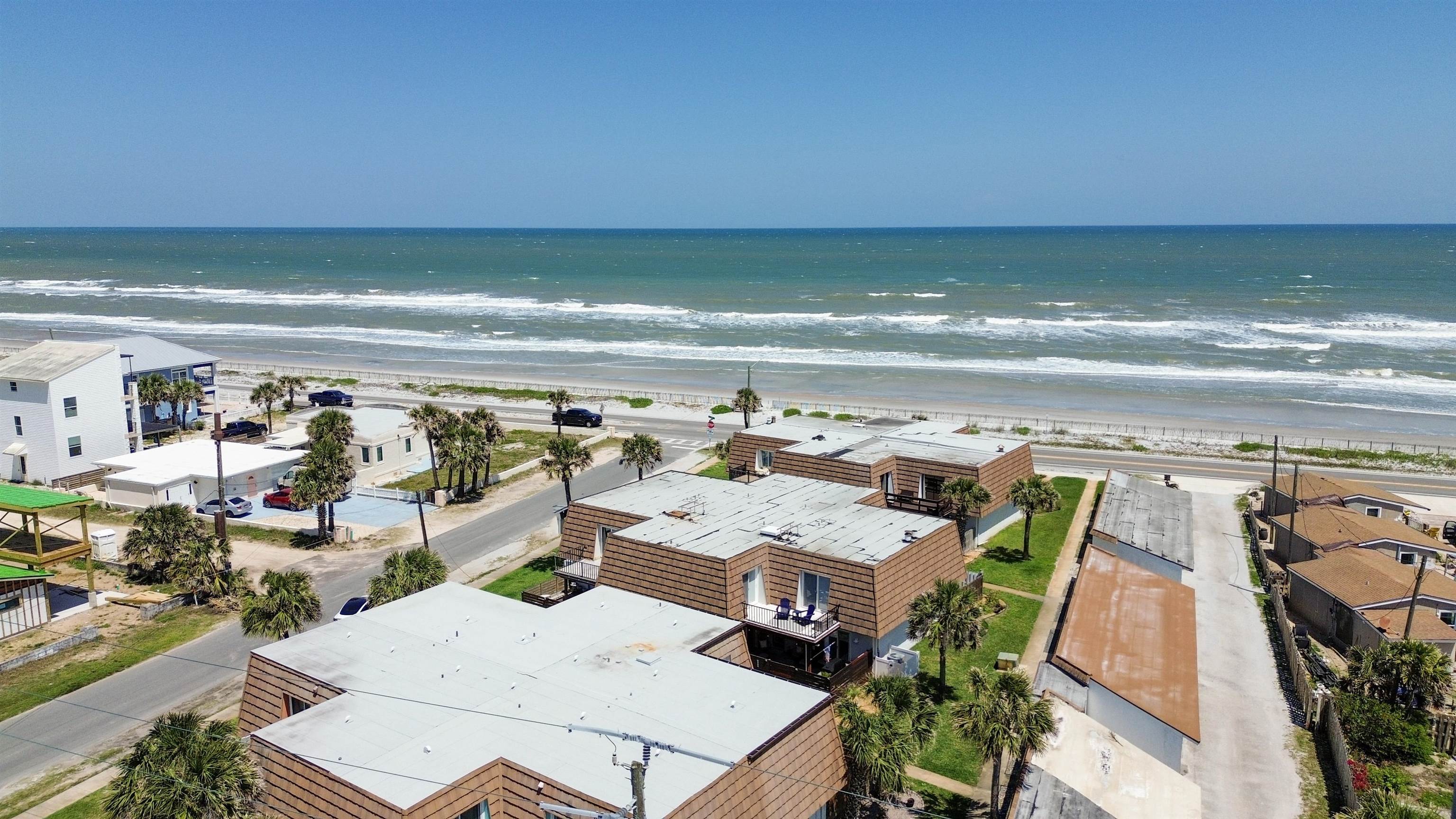 111 South 18th Street Flagler Beach, FL 32136 - Photo 33 of 38 a view of a patio with furniture and floor to ceiling window
