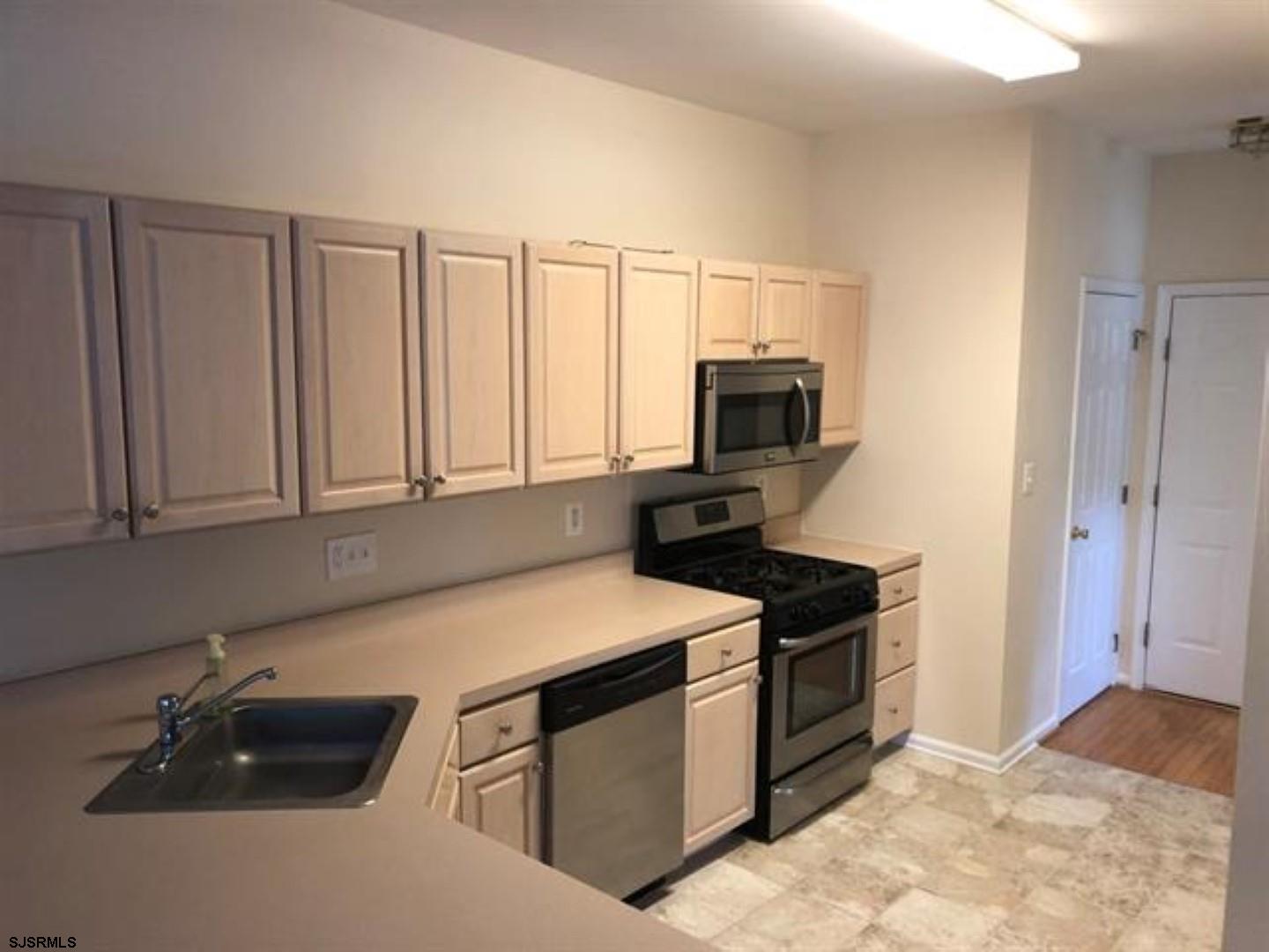 32 Summit Circle Mays Landing, NJ 08330 - Photo 3 of 31 a kitchen with a sink and white cabinets