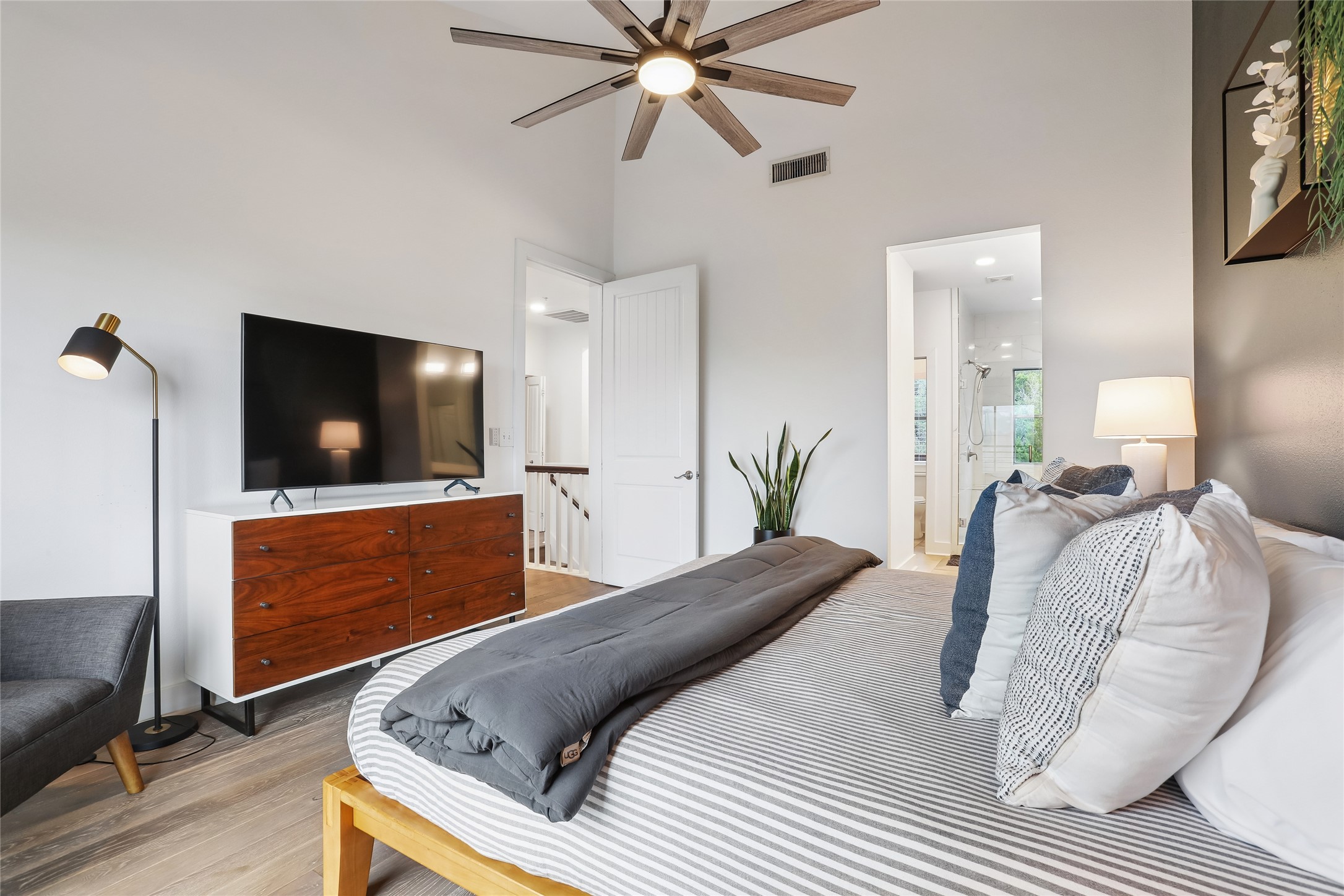 8110 Ranch Road 2222, Unit 10 Austin, TX 78730 - Photo 9 of 23 a bedroom with a bed and a flat screen tv