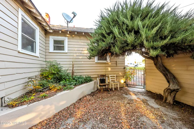 a view of a two chairs in the patio