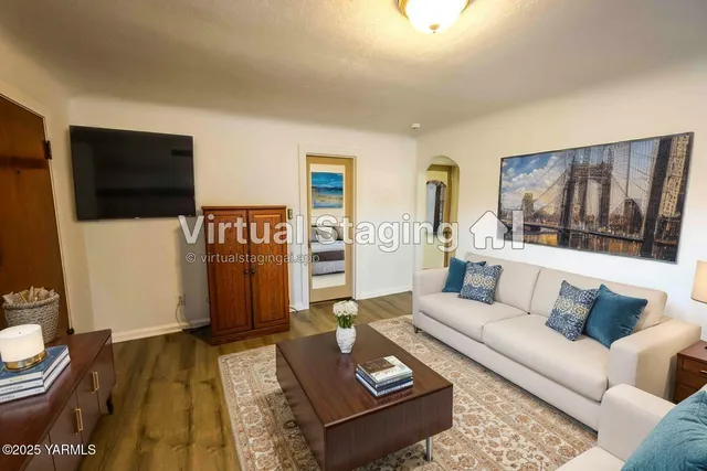 a living room with furniture and a flat screen tv