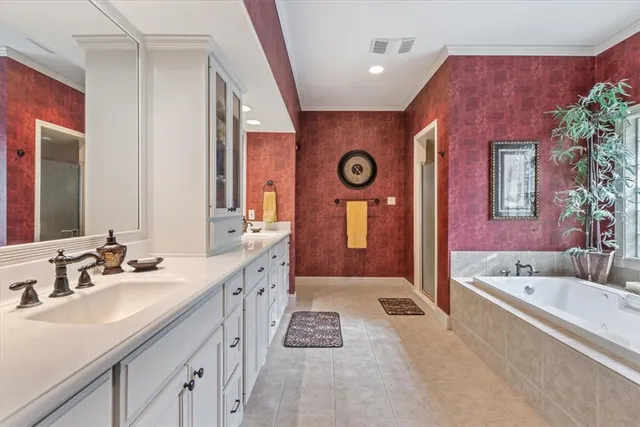 a bathroom with a sink a toilet and shower curtain