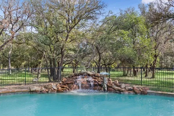 a view of a park with large trees