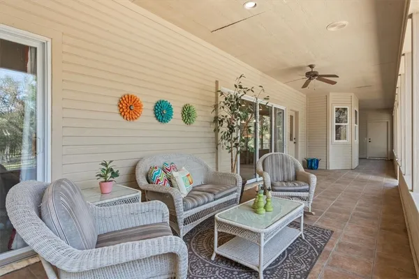 a view of a patio with a table and chairs