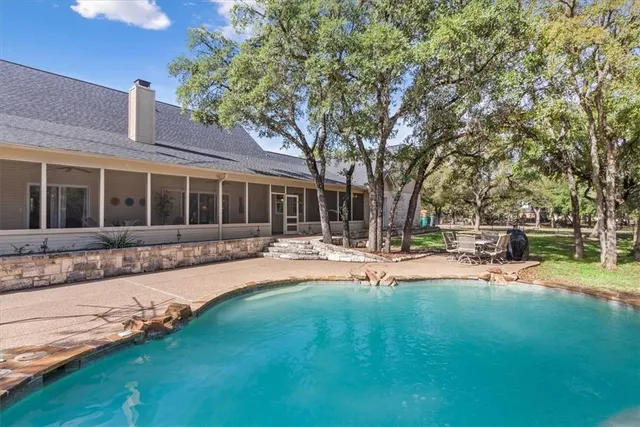 a view of house with a yard