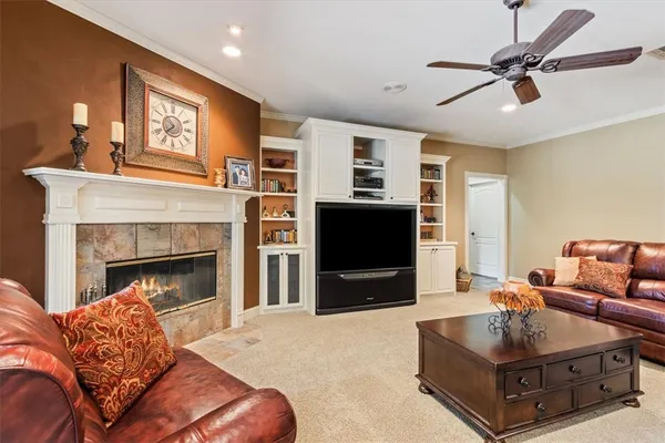 a living room with furniture and a fireplace