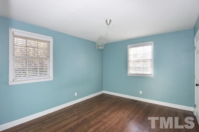 1212 North King Charles Road Raleigh, NC 27610 - Photo 11 of 16 a view of a room with wooden floor and windows