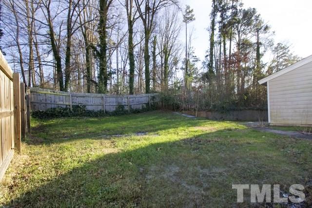 1212 North King Charles Road Raleigh, NC 27610 - Photo 15 of 16 a view of a backyard with large trees