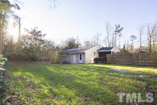 1212 North King Charles Road Raleigh, NC 27610 - Photo 16 of 16 a view of a house with a yard and garage